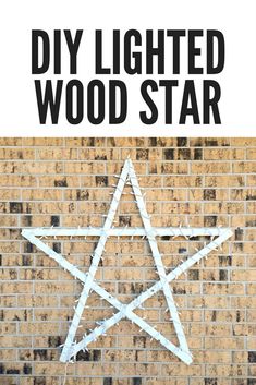 a white star on a brick wall with the words diy lighted wood star