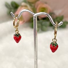 Add a sweet touch to your style with these Tiny Strawberry Hoops from Nohemn by Nohelia. These delicate earrings feature charming strawberry charms that bring a playful and fresh vibe to any outfit. Lightweight and easy to wear, they're perfect for everyday use or as a cute accessory for special occasions. 💕 ITEM DETAILS: Earring Dimensions: Total Length: Approx. 2.50 cm Bead Diameter: 0.8 mm Materials: 18K Gold Plated hoops - Enamel Strawberry Charm Color available: Gold Hoops - Red with Green Strawberry Earrings, Fruit Fruit, Green Charms, Strawberry Charm, Ocean Water, Earrings Hoop, Delicate Earrings, Huggie Hoop Earrings, Charm Gift