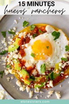 an egg is on top of a tortilla topped with avocado and cilantro