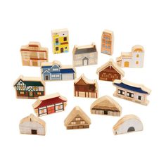 small wooden buildings are shown on a white background