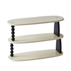 three tiered shelf with two black and white shelves on one side, the other half empty