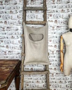 a wooden chair sitting next to a mannequin head