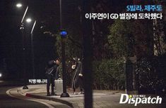 three men standing on the side of a road at night with their suitcases in hand