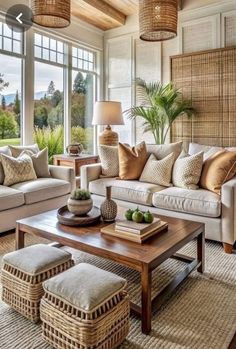 a living room filled with furniture and lots of windows