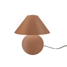 a lamp with a brown shade on the side and a white cord attached to it