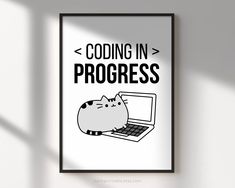 a black and white poster with a cat sitting on top of a laptop that says,'coding in progress '