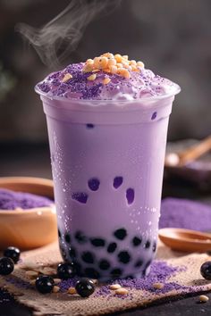 a purple drink with blueberries and other toppings