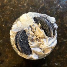 an oreo cookie and ice cream dessert in a plastic container on a counter top