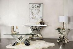 a glass table sitting on top of a white rug