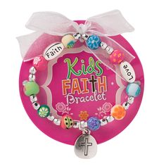 a pink bracelet with a cross and beads on it that says, kids faith brought