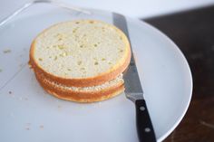 a sandwich on a plate with a knife