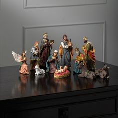 a group of figurines sitting on top of a table