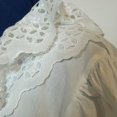 Very nice original folk blouse, with lovely lace embellishment. The blouse is old but in very good condition. The size is app. 48/XL Measurements: Bust: 122cm Waist: 114cm Length: 66cm Sleeve length: 64cm Spring Cotton Lace Blouse With Broderie Anglaise, White Lace Top With Ruffled Collar, White Feminine Peasant Top With Ruffles, White Ruffled Cotton Peasant Top, White Cotton Peasant Top With Ruffles, Spring Blouse With Lace Collar, Spring Cotton Lace Blouse With Lace Collar, White Tops With Lace Cuffs And Ruffled Collar, White Feminine Collared Blouse