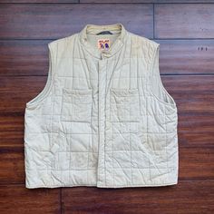 Square quilted cotton hunting vest by Mad Man Button closure two breast pockets and two hip pockets. There is wear yellowing on back and in neck, see images. across chest 24 neck to hem 26 Rebecca Brown, Lee Jacket, Military Pattern, Hunting Vest, Mad Man, Dream Jeans, Man Quilt, Mens Vests, Vest Outfits