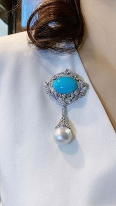 Luxury Turquoise Brooches, Elegant Blue Oval Brooches, Elegant Oval Blue Brooches, Elegant Diamond Gemstone Brooches, Elegant White Gold Brooches With Gemstone, Elegant Blue Gemstone Brooches, Elegant Blue Gemstone Brooch, Elegant Oval Sterling Silver Brooches, Elegant Pendant Brooch With Cabochon