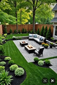 an outdoor patio with seating and landscaping in the back yard, surrounded by green grass