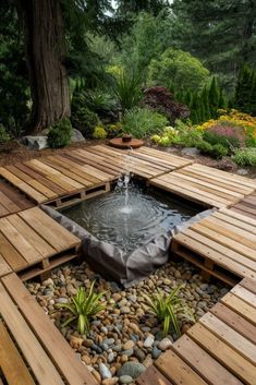 a wooden deck with a water feature in the center