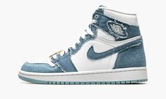 The Women’s Air Jordan 1 High OG “Denim” is a women’s-exclusive version of Michael Jordan’s first signature shoe in a denim-constructed colorway.  A Spring 2022 release, the “Denim” makeup of the vintage basketball shoe features a “do-it-yourself” design with frayed denim overlays against a white leather base.  Specifically, the perforated toe, mid-panel, and collar appear in white leather while the overlays and Swoosh are designed in the aforementioned denim construction with rough edges.  A wh Jordan 1 High Og Denim, Logo Wings, Retro Jordans, Nike Internationalist, Nike Snkrs, Jordan Model, Blue Jordans, Jordan Retro 1, Womens Air Jordans