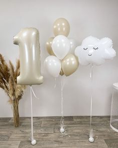 some balloons that are in the shape of numbers one and two