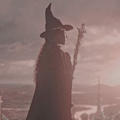 a wizard standing on top of a hill with an american flag in the back ground