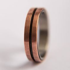 a wedding ring with two black stripes on it