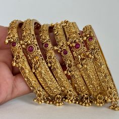 Set of 6 gold Antique Bridal bangles choda set/Bridal bangles/Antique bangles/Gold bangles/Rajwadi bangles/Kundan stone bangles Antique Classic Bangles With Gold Plating This is 100% Handmade jewelry. So Color, shades, texture displayed may slightly vary from the actual product due to digital image limitations. We request you to consider these minor variations. Please expect the possibility of some slight imperfections when buying handmade jewelry. If you have any questions, please message or email us. Arrives in a gift box. Please let me know if you have any questions. Thank you so much for visiting my shop. Luxury Yellow Gold Wedding Bangle, Luxury Chandbali Bangle For Festive Occasions, Festive Bridal Bangle Sets With Stone Work, Traditional Stone Work Bracelets For Puja, Festive Bridal Bangle Sets With Hand Set, Festive Bridal Bangle Sets For Diwali, Kundan Bridal Bangle Sets, Gold Bangle Bracelets With Latkans, Gold Bracelets With Latkans For Wedding