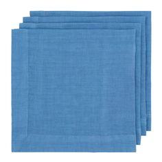 four blue napkins on a white background