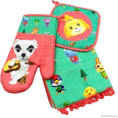 two oven mitts with animals on them, one is green and the other is red