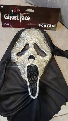 Officially licensed Ghost face mask as Seen in the Scream movie Series.  Custom made with high quality rhinestones that have been hand placed Features & details 100% Polyester Imported Size: Standard White plastic mask Ghost face surrounded by a black shroud *knife is sold separately * **No refunds, no returns, or cancelations ** Ghost Face Mask, Scream Mask, Plastic Mask, The Scream, Scream Movie, Movie Series, Ghost Face, Ghost Faces, Adult Costumes