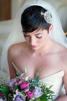 a woman in a wedding dress holding a bouquet