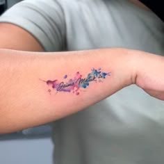 a person with a small tattoo on their arm