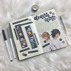 an open book with anime characters on it and two pens laying next to each other