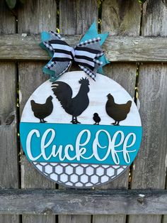 a wooden sign that says, click off with chickens and roosters on the front