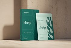 a tube of khelp sitting next to a box on the side of a wall