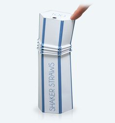 a person's hand is sticking out of a white and blue striped paper tube