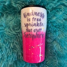 a pink and black coffee cup with writing on it that says kindness is free sprinkles that stuff everywhere