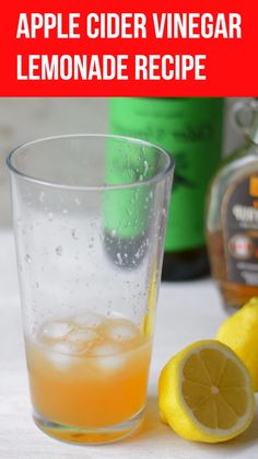 an apple cider vinegar lemonade recipe in a glass next to a sliced lemon