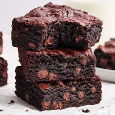 chocolate brownies stacked on top of each other