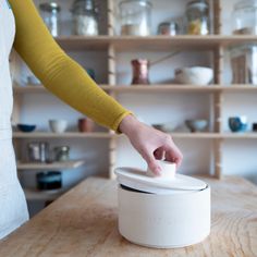 The ceramic food container is handmade in Slovenia on a spindle from natural-coloured chamotte clay and is surrounded by a matt white glaze on the inside. It is designed to store flour, cereals, or other foods that need to be stored in a dark place. The container is double-fired, resistant to crumbling and therefore everlasting. It is suitable for storing a good kilo of flour, and there are three different container shapes, all dishwasher safe. The container is not airtight and is not glazed on Flour Storage, Flour Container, Jar Tea, Countertop Oven, Bread Storage, Ceramic Jars, Different Textures, White Glaze, Food Containers