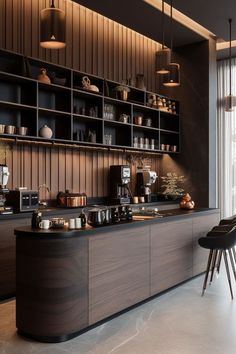 a kitchen with lots of counter space next to a wall mounted shelf filled with pots and pans