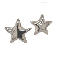 two silver star shaped studs on white background, one is shiny and the other is shiny