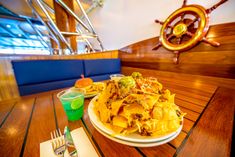 a plate of food sitting on top of a wooden table