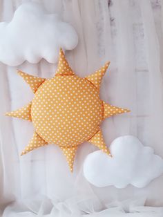 a yellow and white polka dot sun decoration