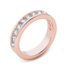 a rose gold wedding ring with three rows of diamonds on the side and one row of white