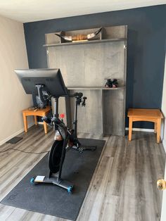 there is a bike and exercise equipment in the room