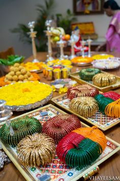 there are many decorative plates on the table