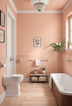 a bathroom with pink walls and wood floors