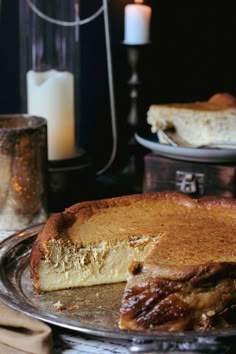 there is a cake on the plate with one slice cut out and ready to be eaten