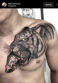 a man's chest with a black and grey tiger tattoo on his left side