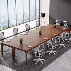 an empty conference table with chairs and plants on it in front of a large window